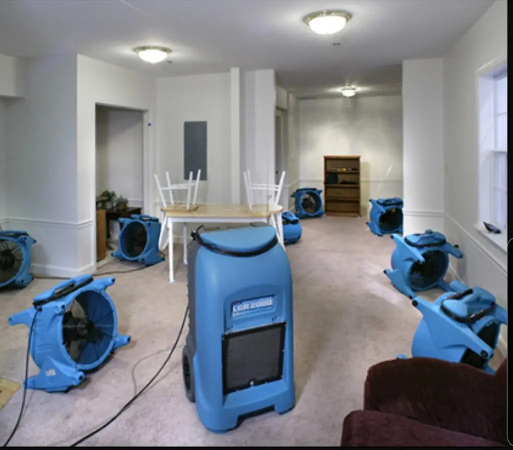 Air movers and dehumidifier setup for Water Extraction & Removal in Granby